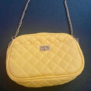 Yellow quilted crossbody bag with gold chain strap